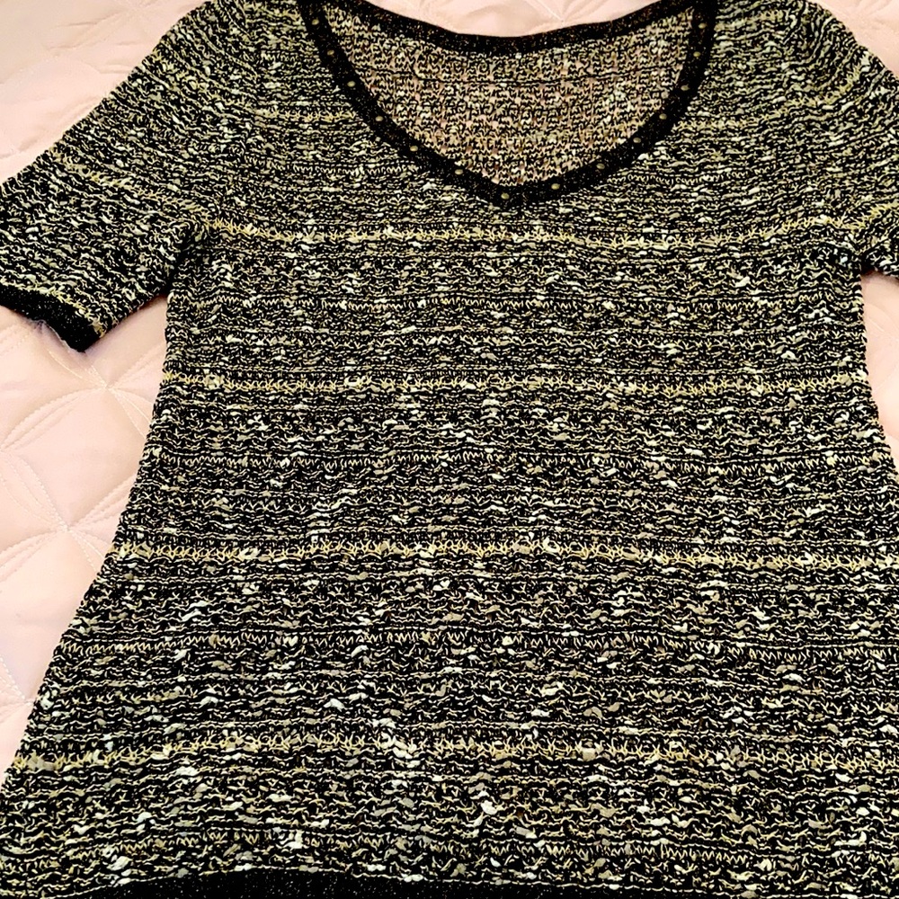 St John Sport Top. Dressy casual. Style it to match your mood.
